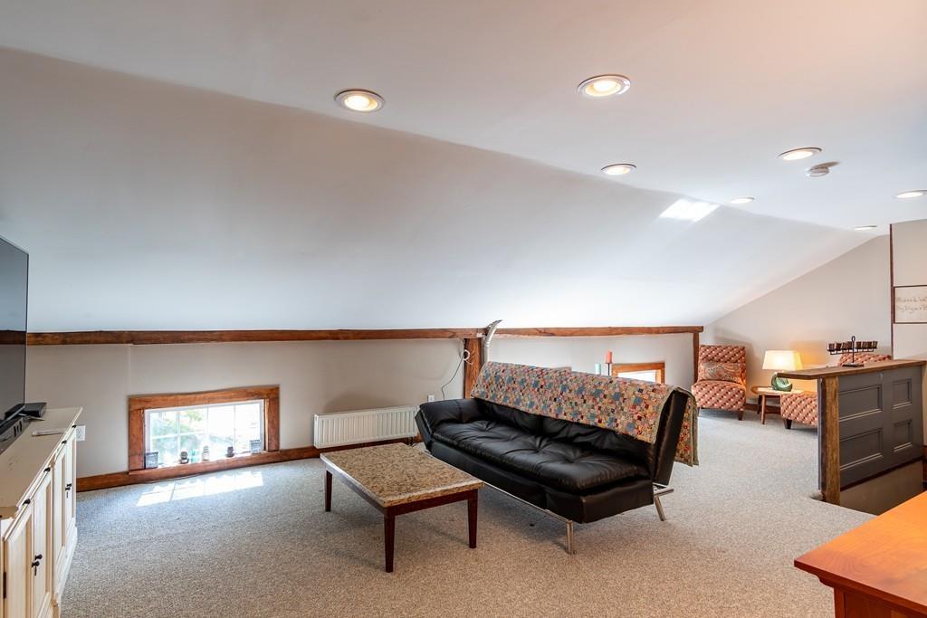 409 Main Road Chesterfield, MA 01012 - Photo 39 of 42 a living room with furniture and a flat screen tv
