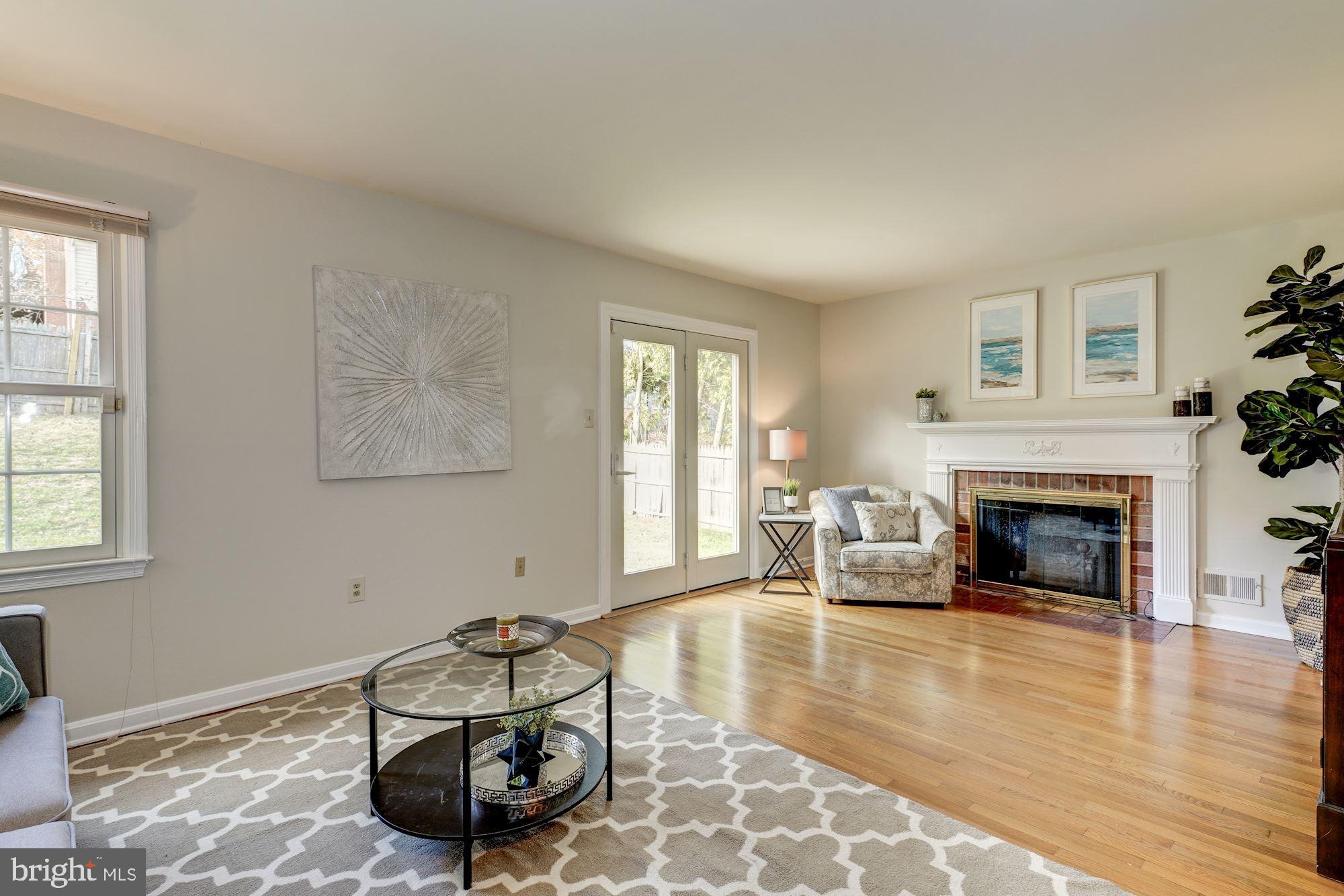 9004 Jones Mill Road Chevy Chase, MD 20815 - Photo 13 of 39 Family room with a wood-burning fireplace