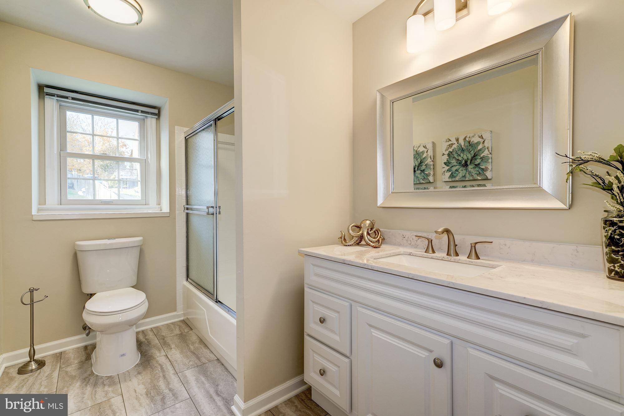 9004 Jones Mill Road Chevy Chase, MD 20815 - Photo 23 of 39 Hall bath with tub & shower & vanity