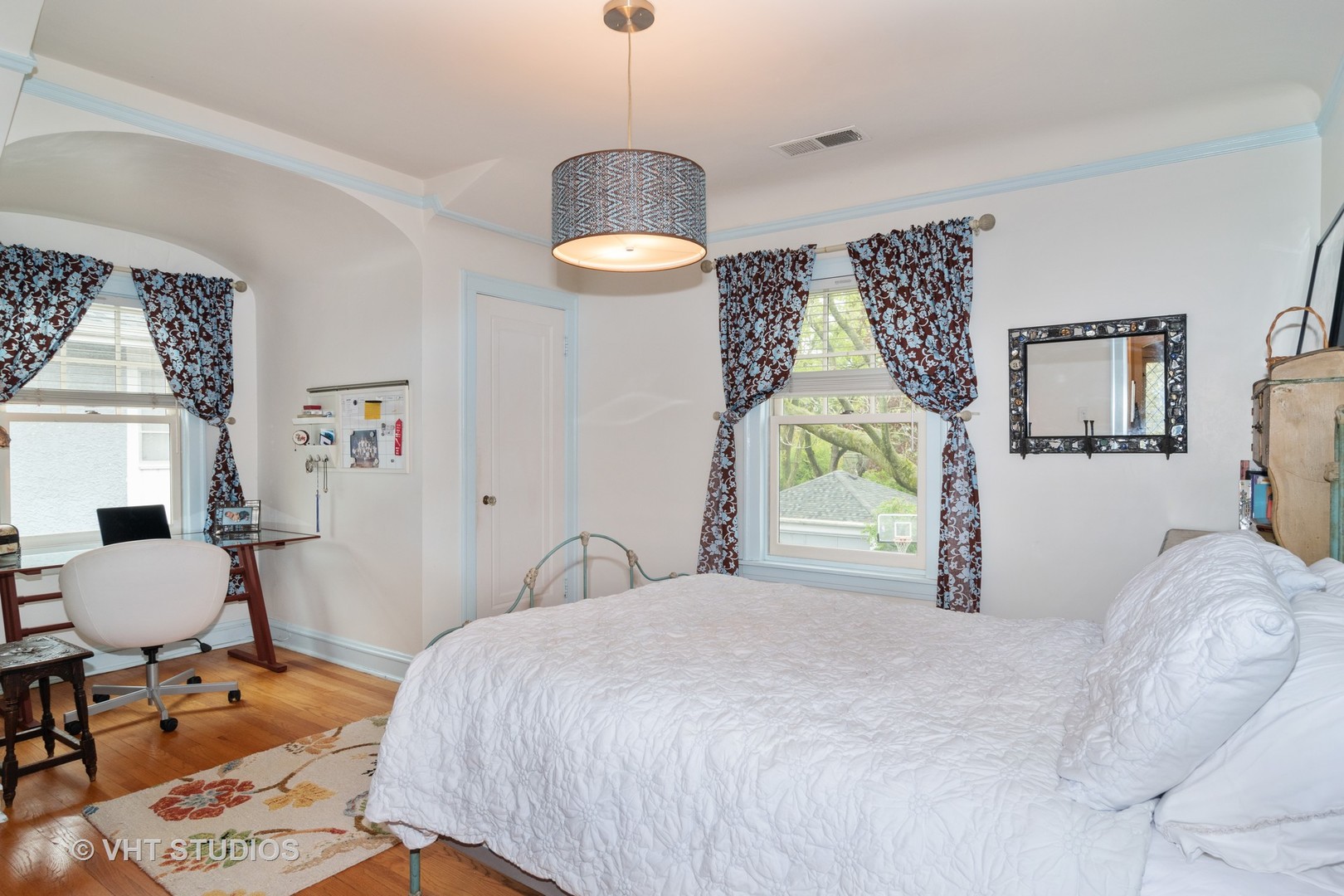 256 Bartram Road Riverside, IL 60546 - Photo 14 of 34 a bedroom with a bed and a chair