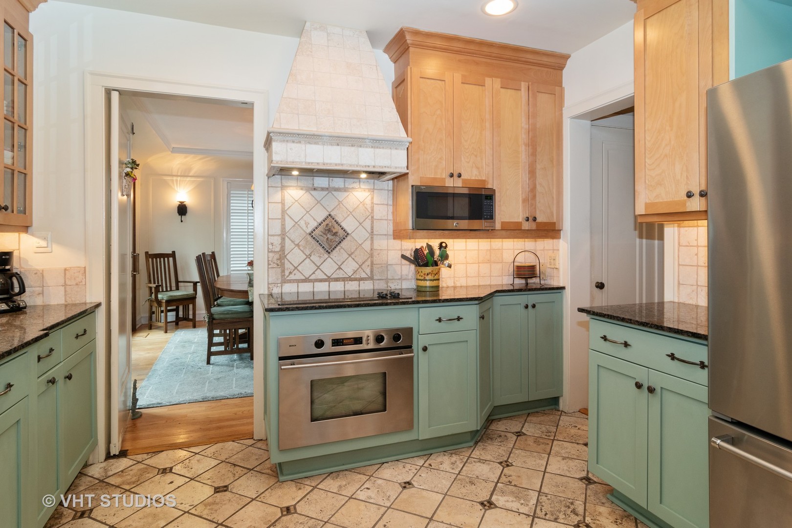 256 Bartram Road Riverside, IL 60546 - Photo 8 of 34 a kitchen with stainless steel appliances granite countertop a stove a sink and a refrigerator