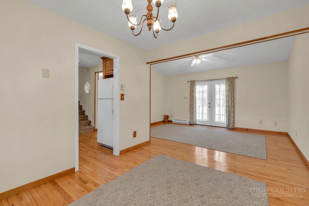 163 Rolling Hill Drive Boone, NC 28607 - Photo 7 of 40 wooden floor in an empty room with a window