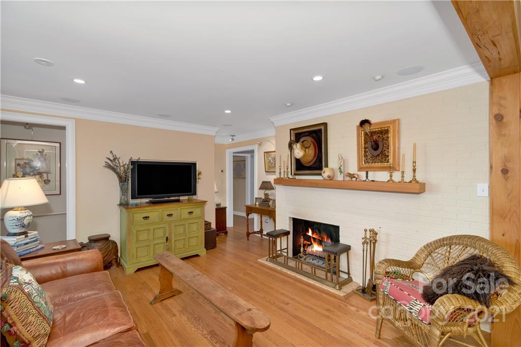 9 Forest Road Biltmore Forest, NC 28803 - Photo 13 of 36 a living room with furniture and a flat screen tv