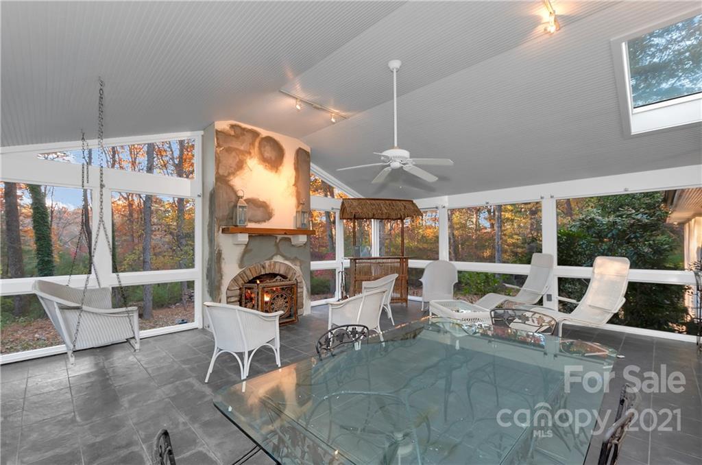 9 Forest Road Biltmore Forest, NC 28803 - Photo 14 of 36 a living room with fireplace furniture and a large window