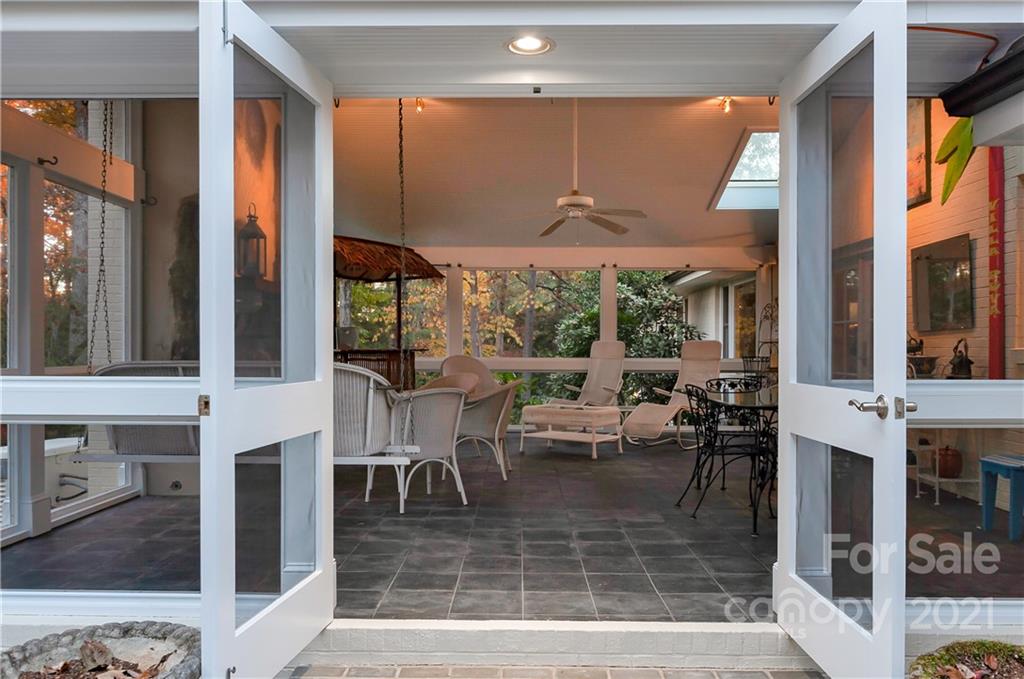 9 Forest Road Biltmore Forest, NC 28803 - Photo 16 of 36 a view of a dining room with furniture window and outside view