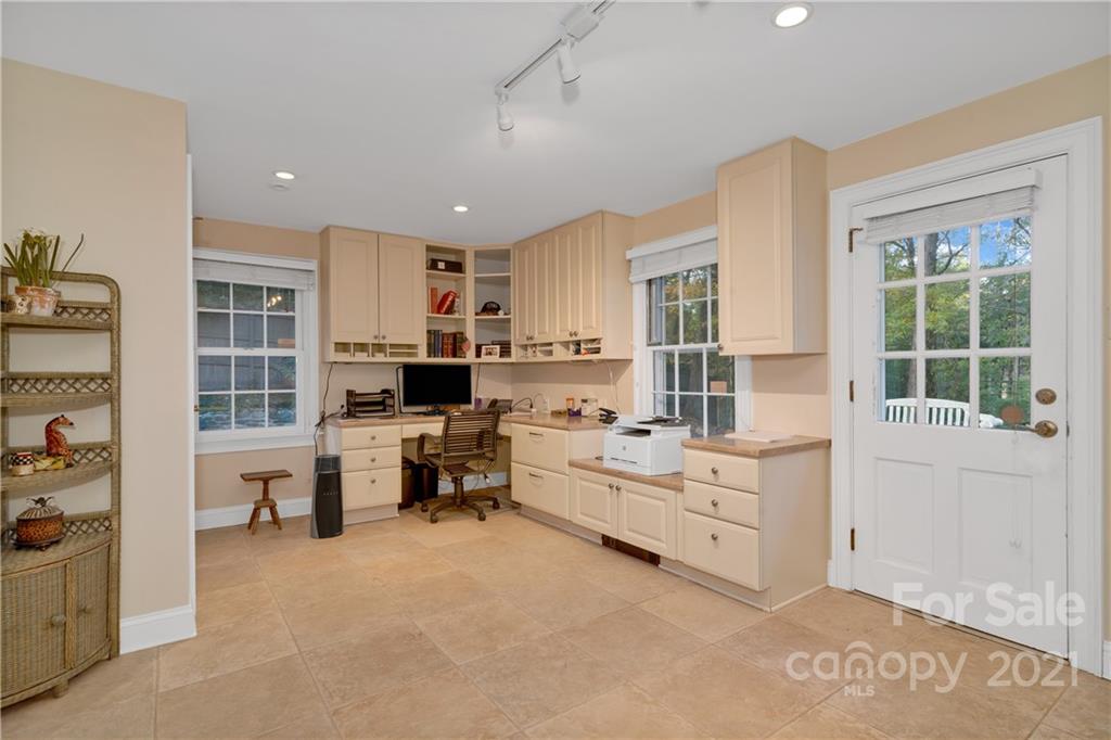 9 Forest Road Biltmore Forest, NC 28803 - Photo 18 of 36 a living room with furniture and a large window