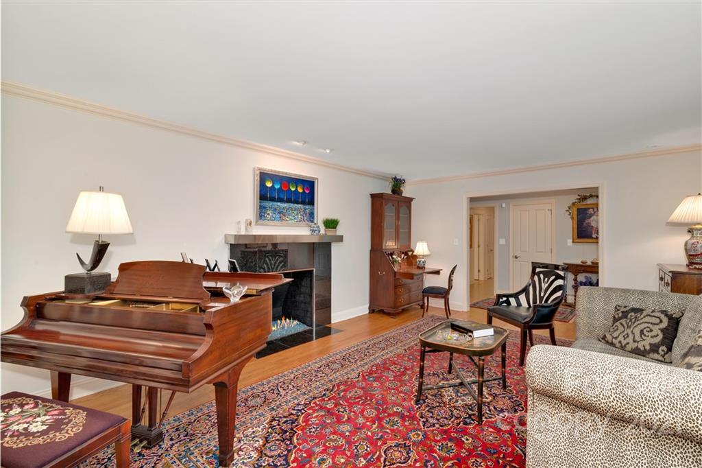 9 Forest Road Biltmore Forest, NC 28803 - Photo 6 of 36 a living room with furniture and a fireplace
