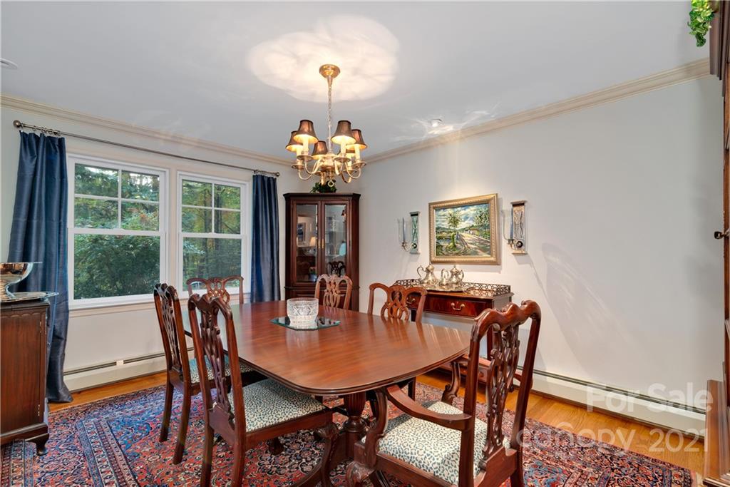 9 Forest Road Biltmore Forest, NC 28803 - Photo 8 of 36 a view of a dining room with furniture window and outside view
