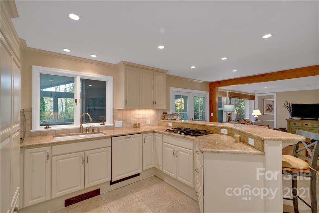 9 Forest Road Biltmore Forest, NC 28803 - Photo 9 of 36 a kitchen with sink and mirror