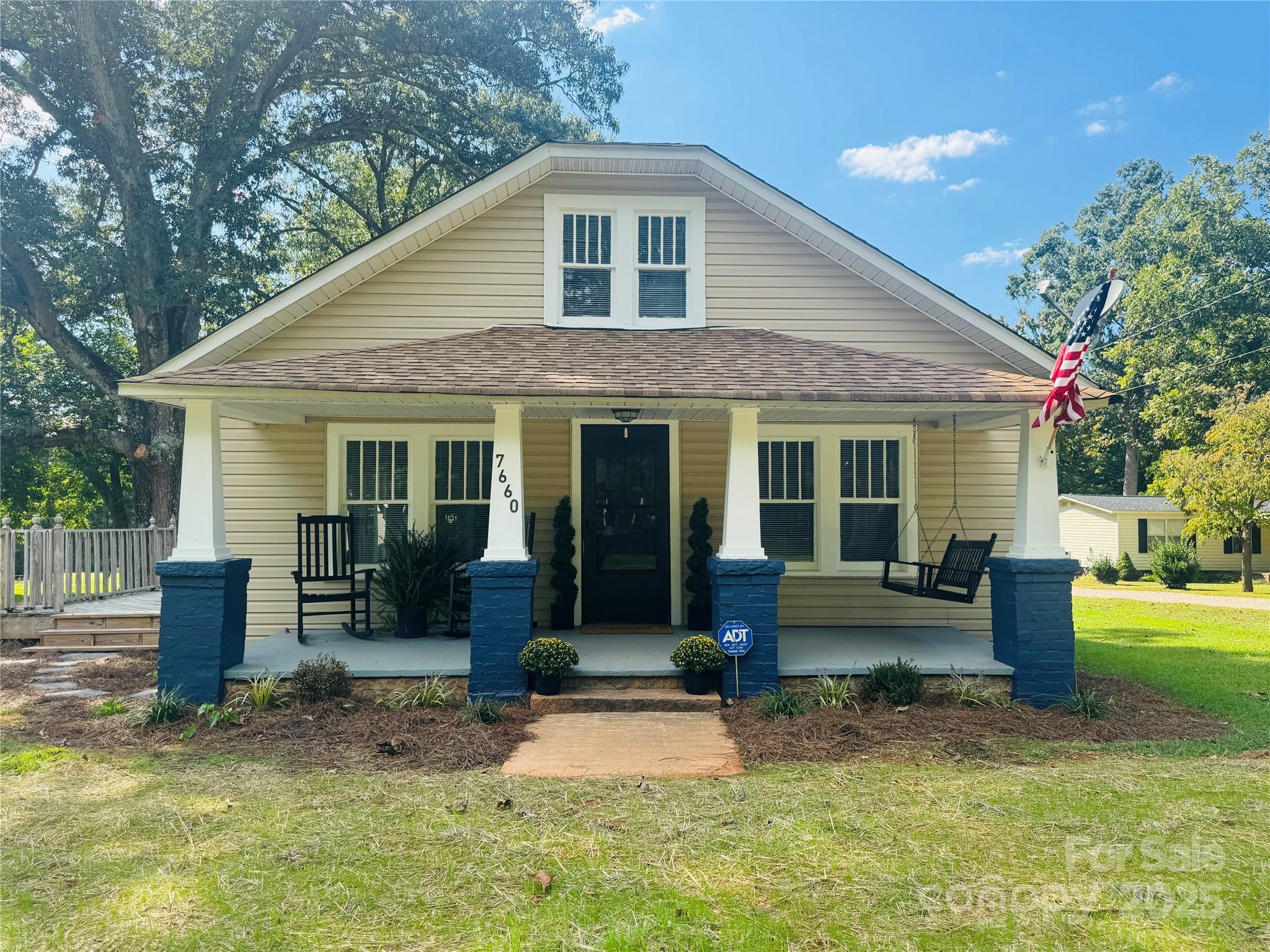 7660 Pop Basinger Road Rockwell, NC 28138 - Photo 1 of 28 a front view of a house with a yard and seating space