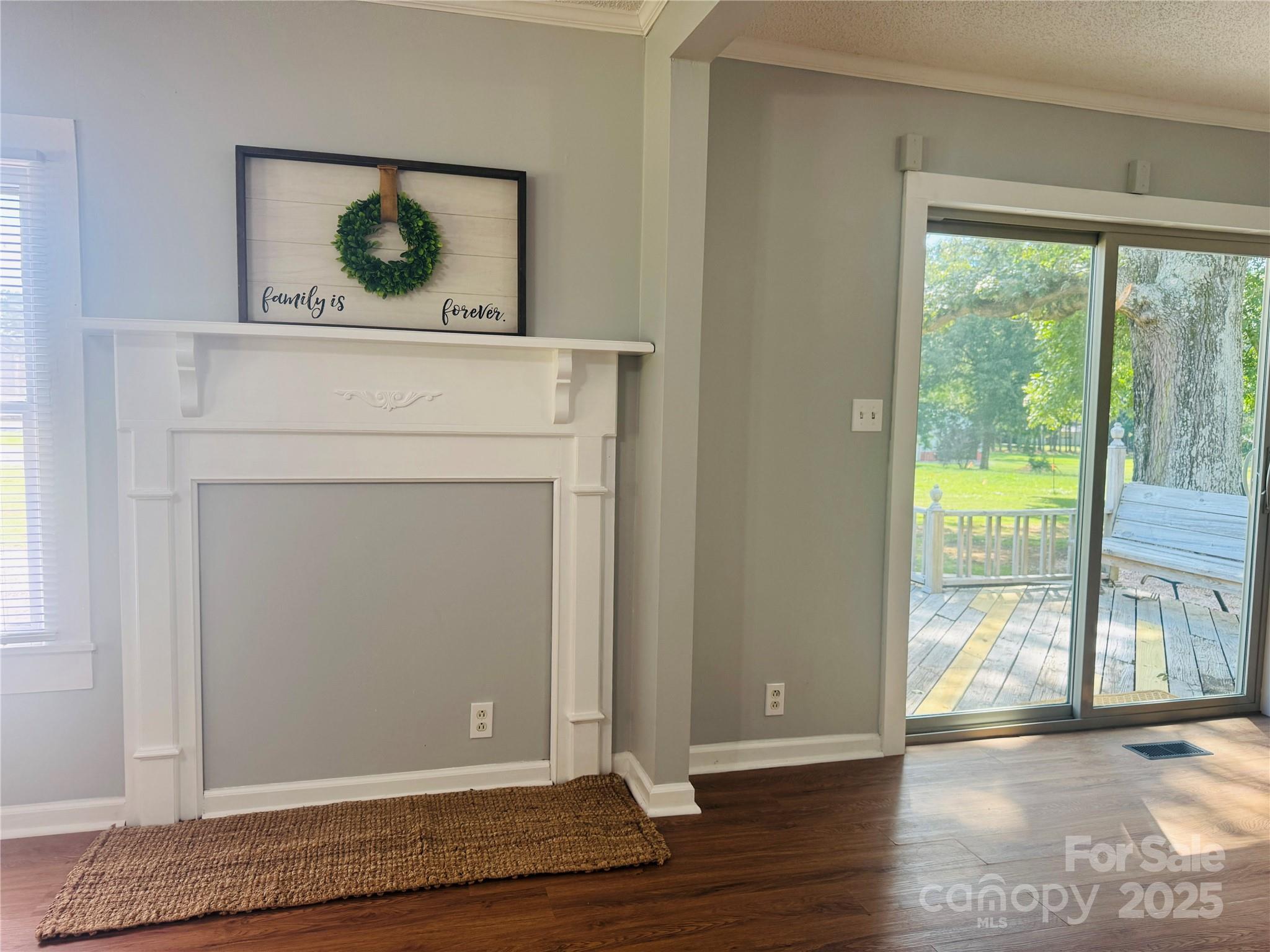 7660 Pop Basinger Road Rockwell, NC 28138 - Photo 8 of 28 a view of a hallway with wooden floor and a bookshelf
