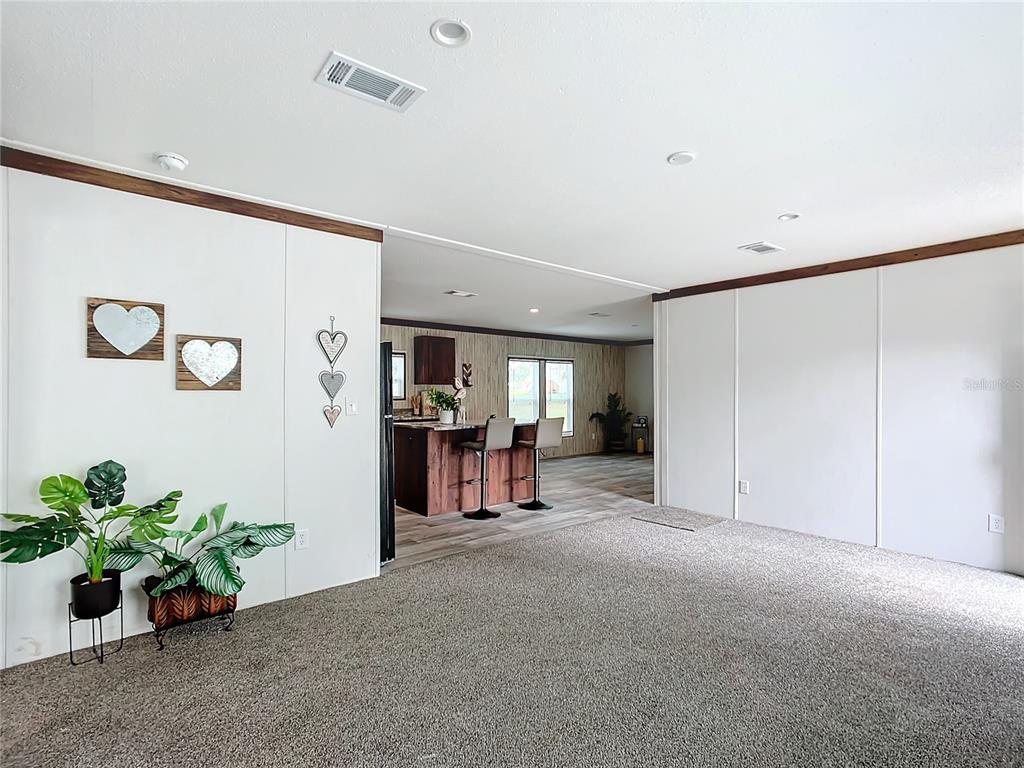 8551 Northwest 125 Street Chiefland, FL 32626 - Photo 13 of 35 a view of livingroom with hardwood and hallway