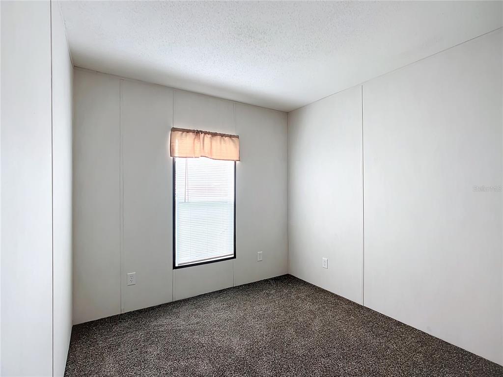 8551 Northwest 125 Street Chiefland, FL 32626 - Photo 18 of 35 an empty room with windows