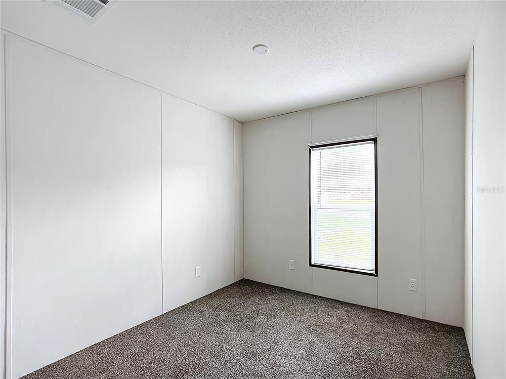 8551 Northwest 125 Street Chiefland, FL 32626 - Photo 22 of 35 an empty room with windows