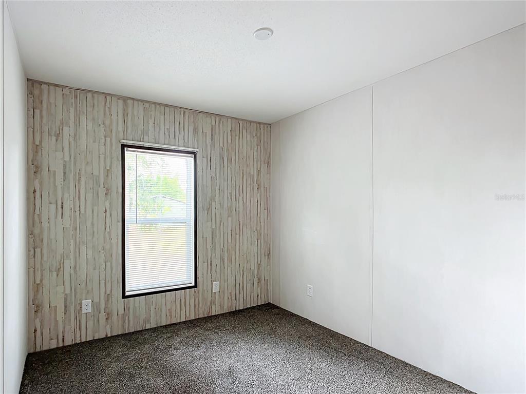 8551 Northwest 125 Street Chiefland, FL 32626 - Photo 23 of 35 an empty room with windows