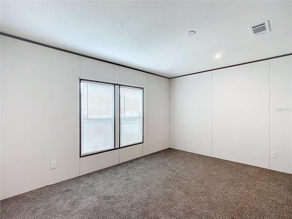 8551 Northwest 125 Street Chiefland, FL 32626 - Photo 26 of 35 an empty room with windows