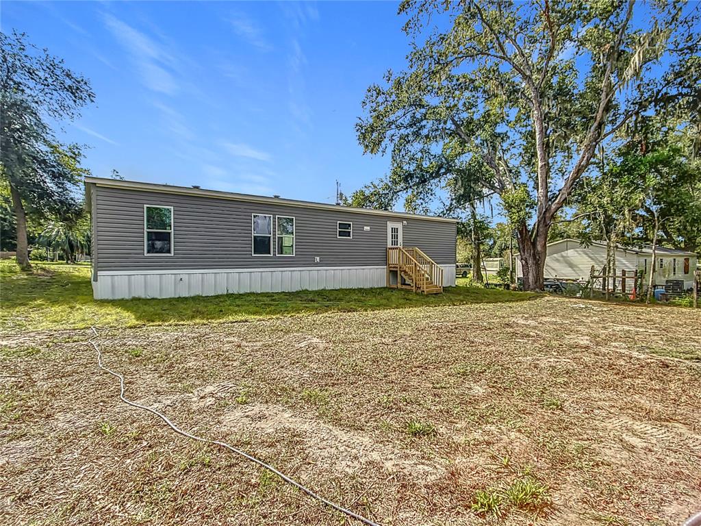 8551 Northwest 125 Street Chiefland, FL 32626 - Photo 34 of 35 a view of a house with a yard