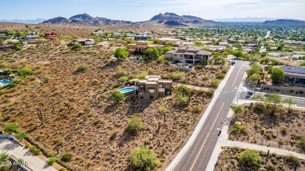 an aerial view of residential house and an outdoor space