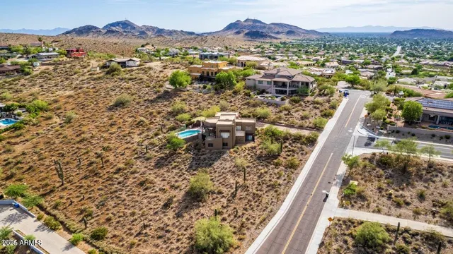 an aerial view of residential house and an outdoor space