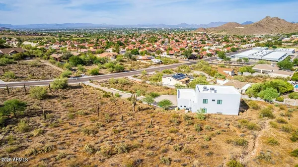an aerial view of residential houses with outdoor space