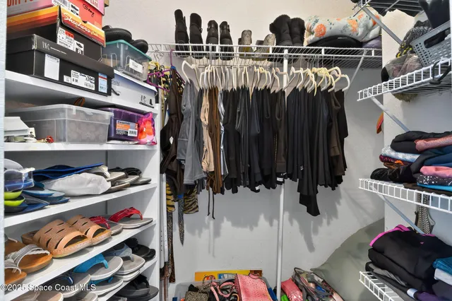 a bedroom with furniture and a lamp