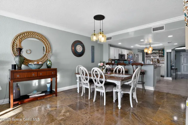 a living room with furniture tv and a floor to ceiling window