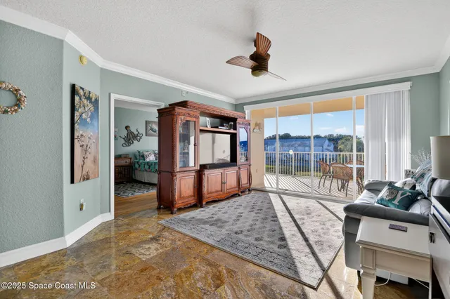 a outdoor view with a sitting space and large trees