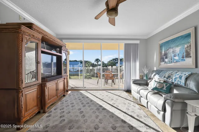a dining room with furniture a rug and a chandelier