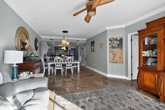 a kitchen with stainless steel appliances granite countertop a refrigerator a stove a sink and a microwave