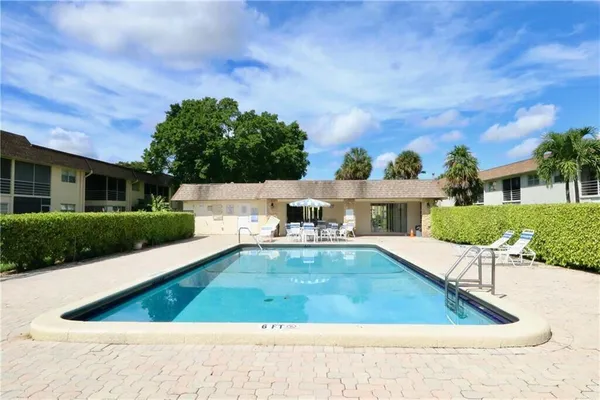 a view of a swimming pool with a patio