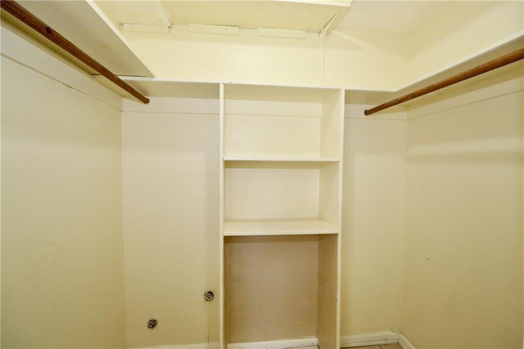 9915 Sandalfoot Boulevard, Unit 408 Boca Raton, FL 33428 - Photo 15 of 19 a view of an empty walk in closet