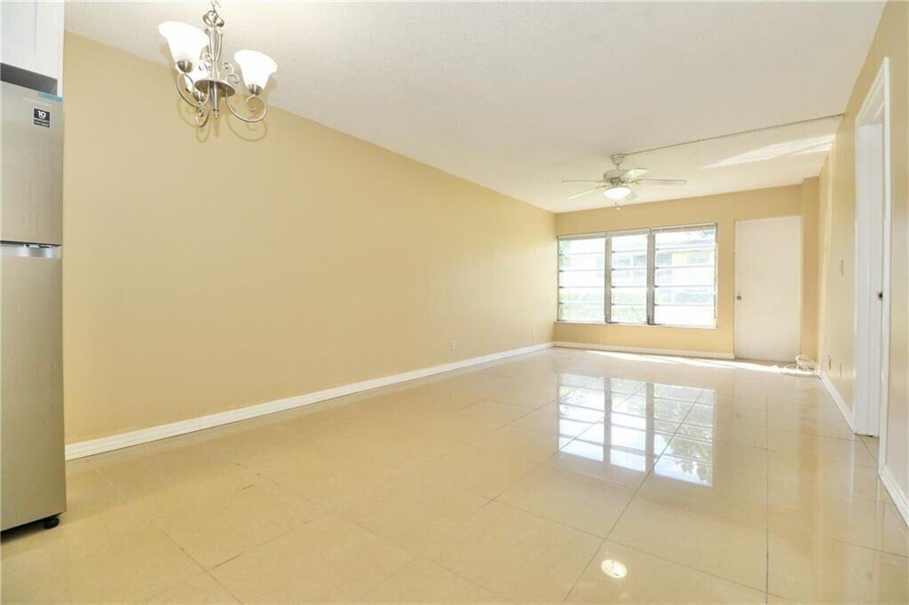 9915 Sandalfoot Boulevard, Unit 408 Boca Raton, FL 33428 - Photo 19 of 19 a view of an empty room with a window