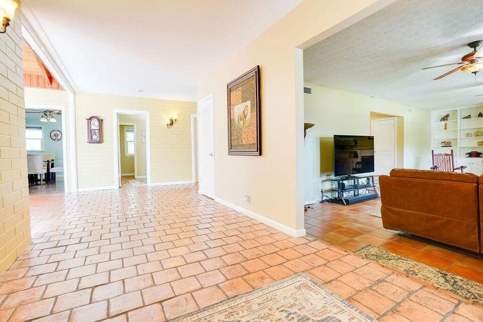 7600 Immokolee Road Fort Pierce, FL 34951 - Photo 13 of 32 a living room with furniture and a flat screen tv