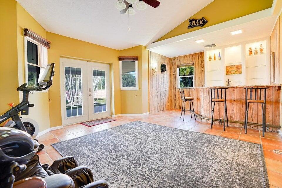 7600 Immokolee Road Fort Pierce, FL 34951 - Photo 19 of 32 a view of a livingroom with furniture and a window