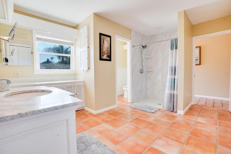 7600 Immokolee Road Fort Pierce, FL 34951 - Photo 21 of 32 a bathroom with a sink and a shower