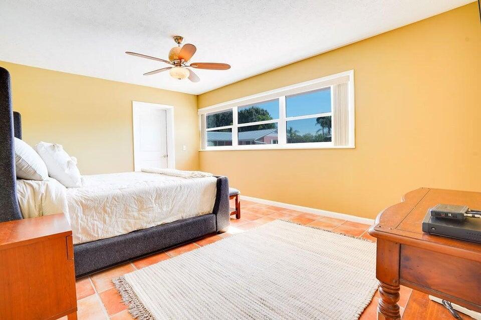7600 Immokolee Road Fort Pierce, FL 34951 - Photo 22 of 32 a bedroom with a bed and a window