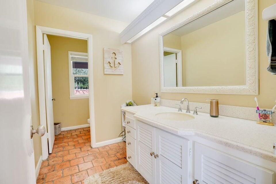 7600 Immokolee Road Fort Pierce, FL 34951 - Photo 32 of 32 a bathroom with a sink and a mirror