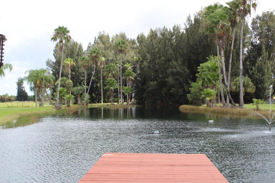 7600 Immokolee Road Fort Pierce, FL 34951 - Photo 8 of 32 a backyard of a house with lots of green space