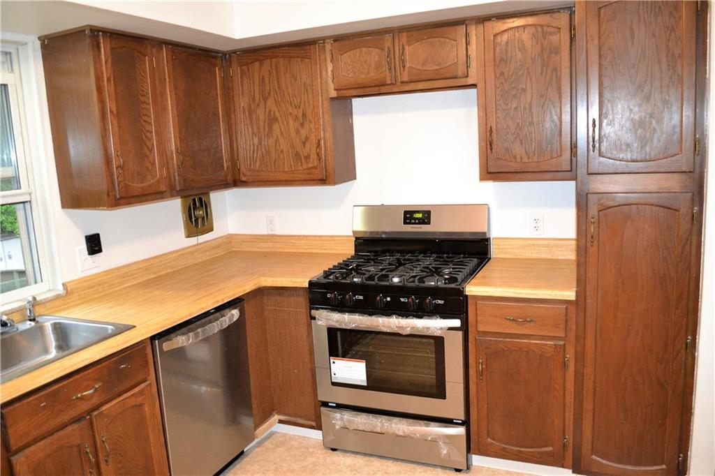 623 Snowball Road Monroeville, PA 15146 - Photo 10 of 23 KITCHEN New flooring was just placed in the kitchen and all of the stainless steel appliances are brand new!
