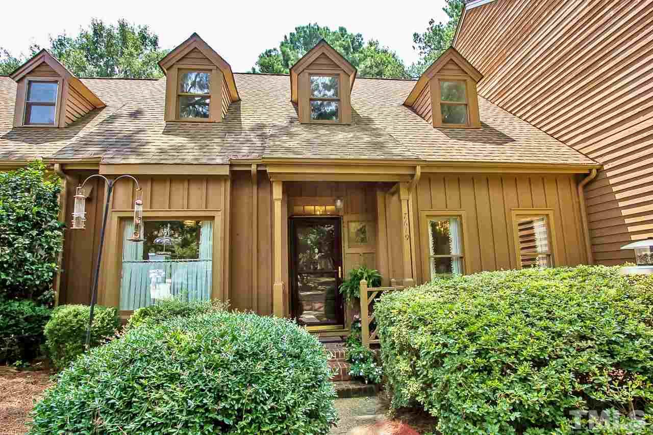 7619 Trowbridge Court Raleigh, NC 27613 - Photo 1 of 25 a front view of a house with garden