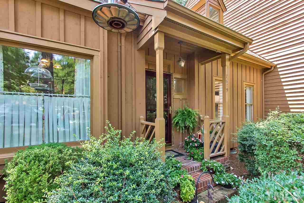 7619 Trowbridge Court Raleigh, NC 27613 - Photo 2 of 25 a front view of a house with garden