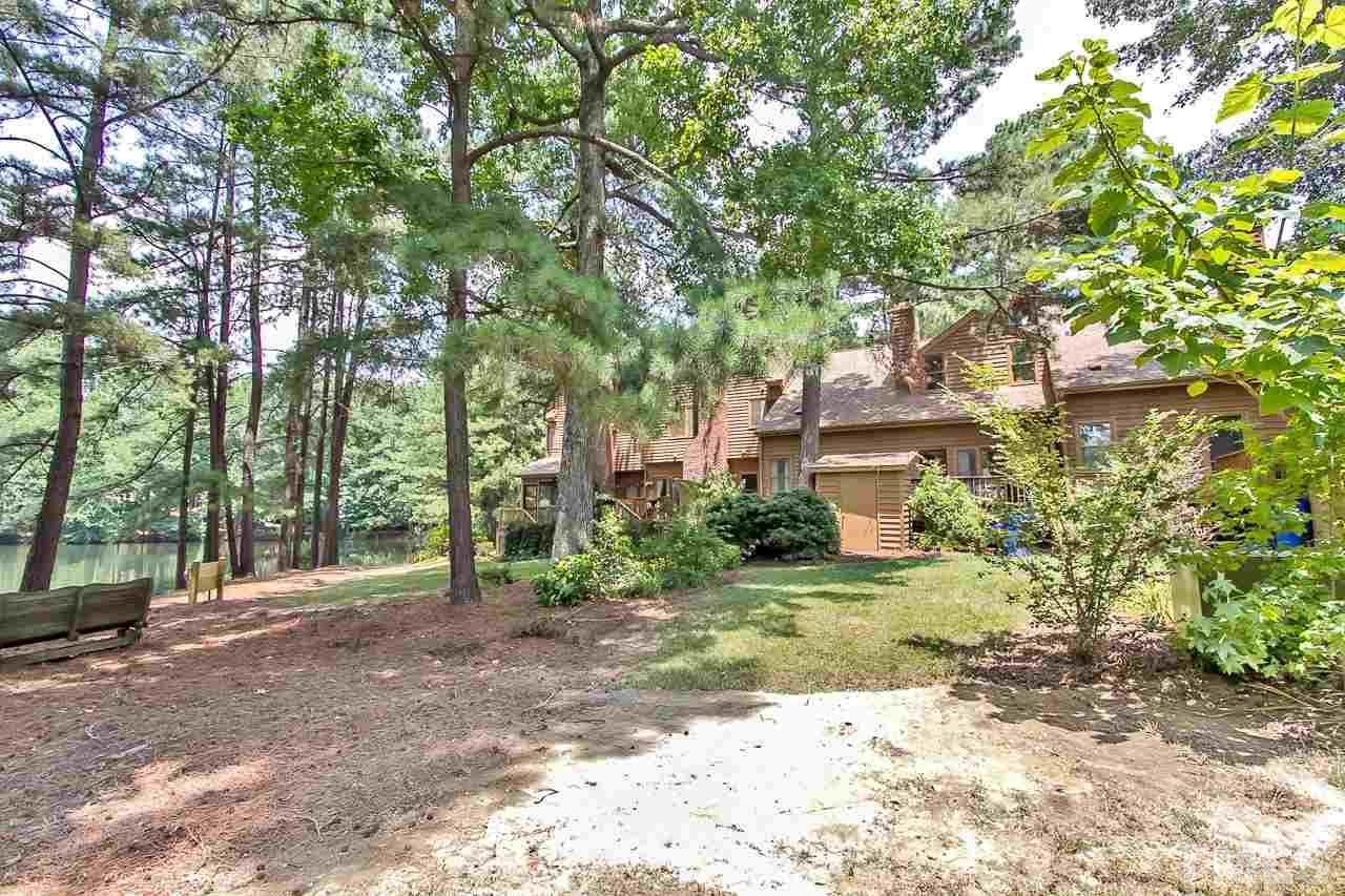 7619 Trowbridge Court Raleigh, NC 27613 - Photo 20 of 25 a view of a yard with plants and trees