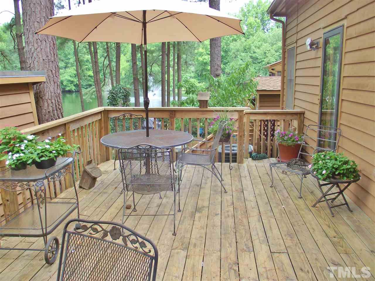 7619 Trowbridge Court Raleigh, NC 27613 - Photo 22 of 25 a view of a two chairs and table in the patio