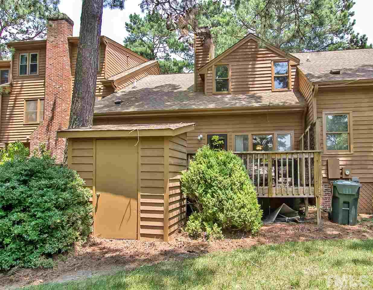 7619 Trowbridge Court Raleigh, NC 27613 - Photo 23 of 25 a view of a house with a yard