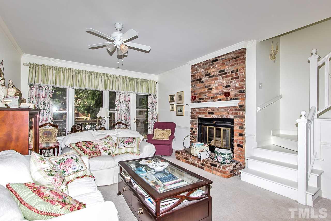 7619 Trowbridge Court Raleigh, NC 27613 - Photo 10 of 25 a living room with furniture fireplace and flat screen tv