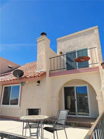a view of a dining room with furniture wooden floor and chandelier