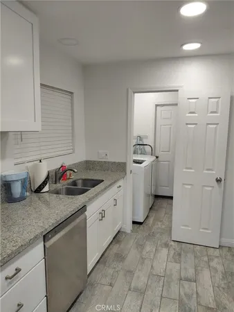 a kitchen that has a sink and a stove