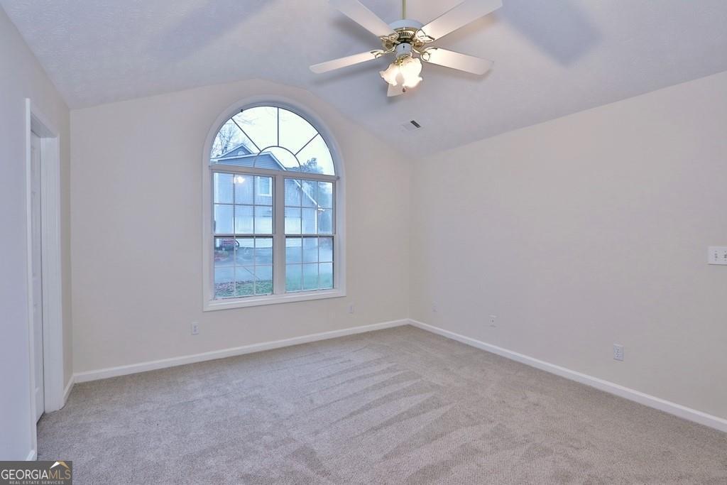 154 Leighs Grove Court Grayson, GA 30017 - Photo 2 of 11 an empty room with a window