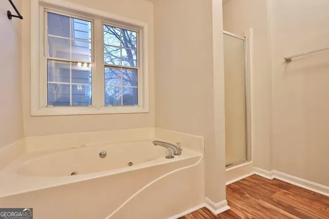 a white bath tub sitting next to a window