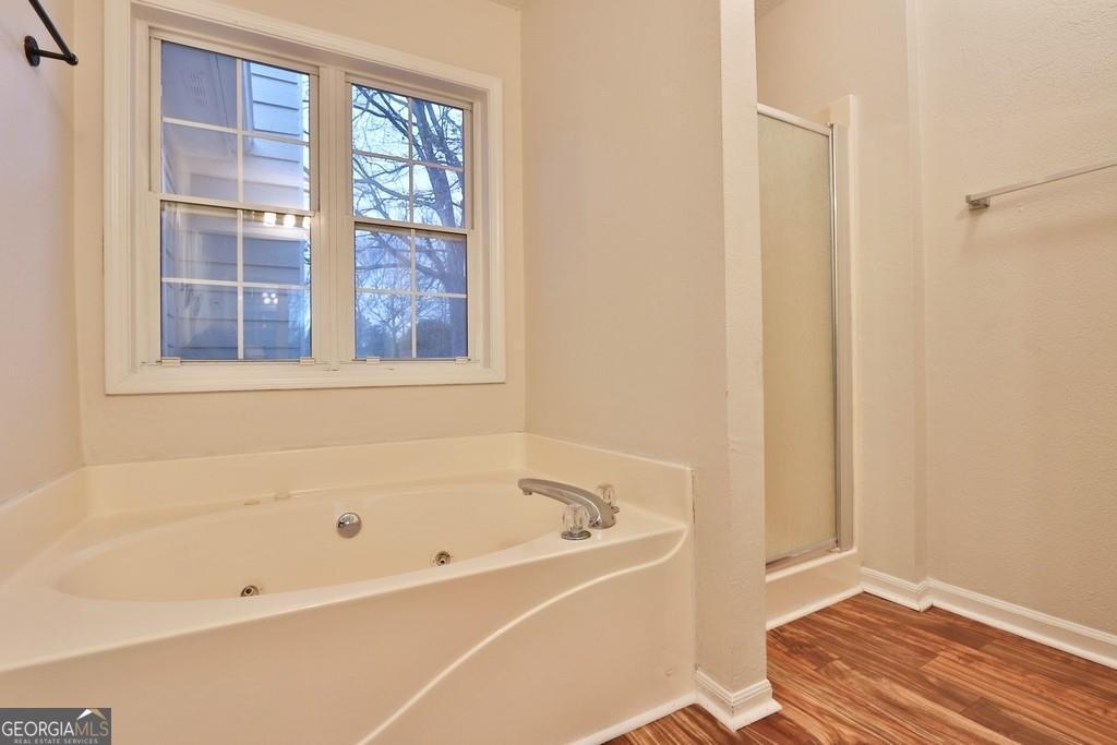 154 Leighs Grove Court Grayson, GA 30017 - Photo 10 of 11 a white bath tub sitting next to a window